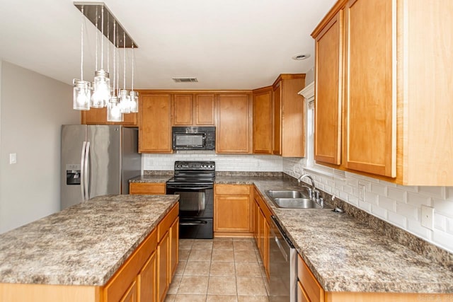 kitchen with a center island, sink, tasteful backsplash, and black appliances