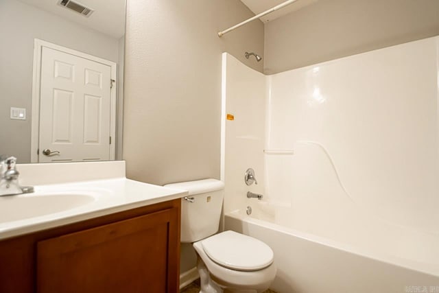 full bathroom with vanity, bathing tub / shower combination, and toilet