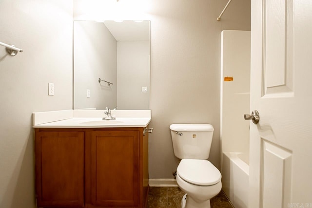 bathroom featuring vanity, tile patterned flooring, and toilet