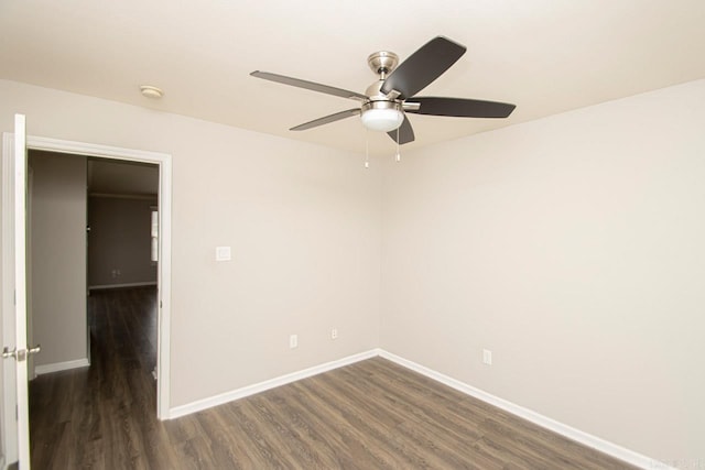 unfurnished room with dark hardwood / wood-style floors and ceiling fan