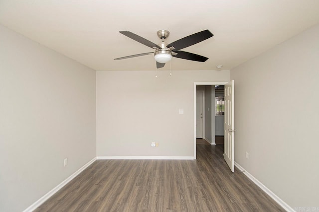 unfurnished room with ceiling fan and dark wood-type flooring