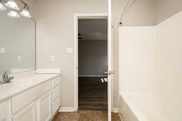 bathroom featuring vanity,  shower combination, and hardwood / wood-style flooring