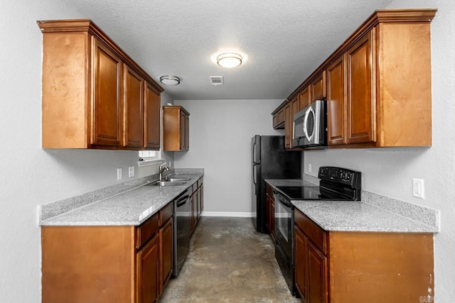 kitchen featuring a textured ceiling, appliances with stainless steel finishes, and sink