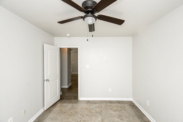 spare room featuring ceiling fan and a textured ceiling