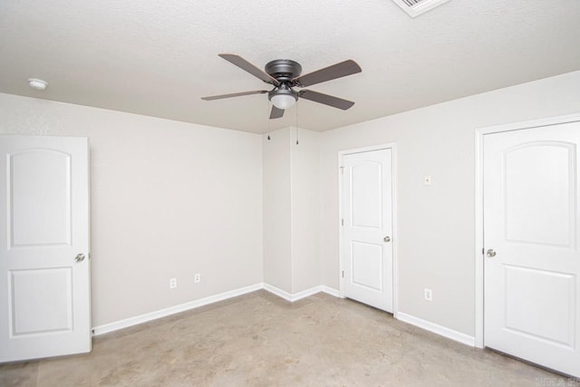 unfurnished room featuring ceiling fan, a textured ceiling, and light carpet