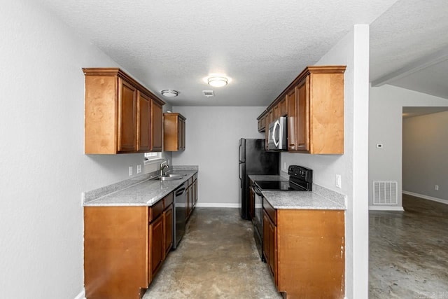 kitchen featuring concrete flooring, a textured ceiling, appliances with stainless steel finishes, and sink