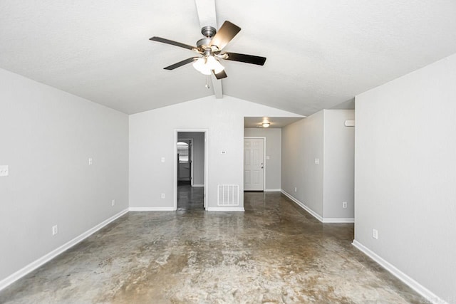 spare room featuring vaulted ceiling with beams, ceiling fan, and a textured ceiling