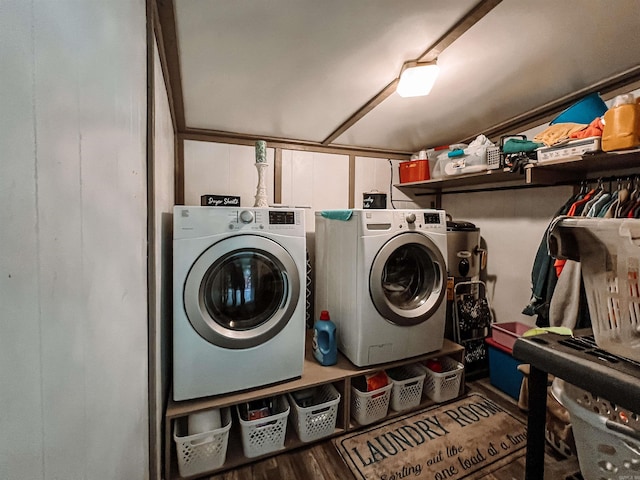 clothes washing area featuring separate washer and dryer and hardwood / wood-style flooring