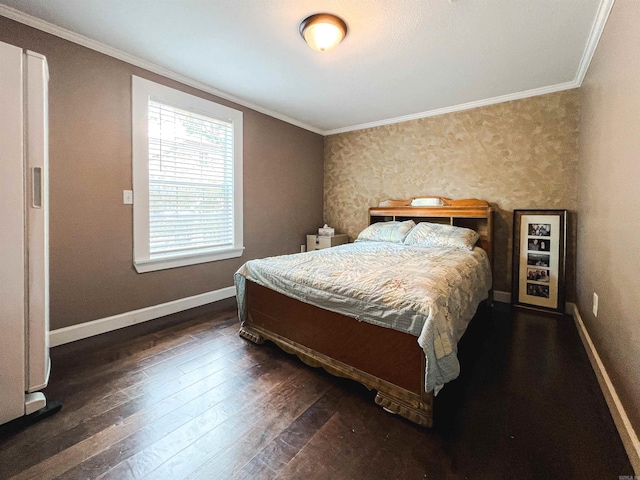 bedroom with crown molding and dark hardwood / wood-style flooring