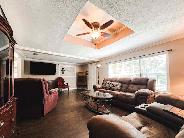 living room featuring ceiling fan, a raised ceiling, dark hardwood / wood-style floors, and a textured ceiling