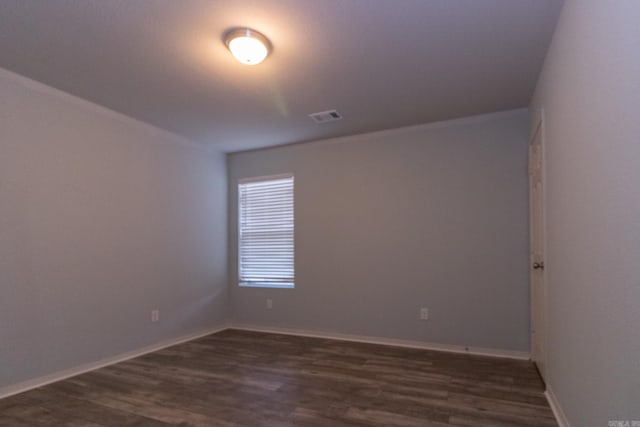 spare room featuring dark hardwood / wood-style floors