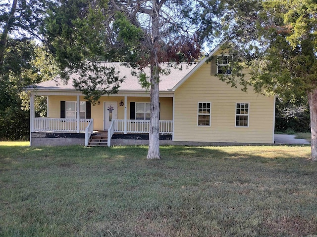 view of front of home with covered porch and a front yard