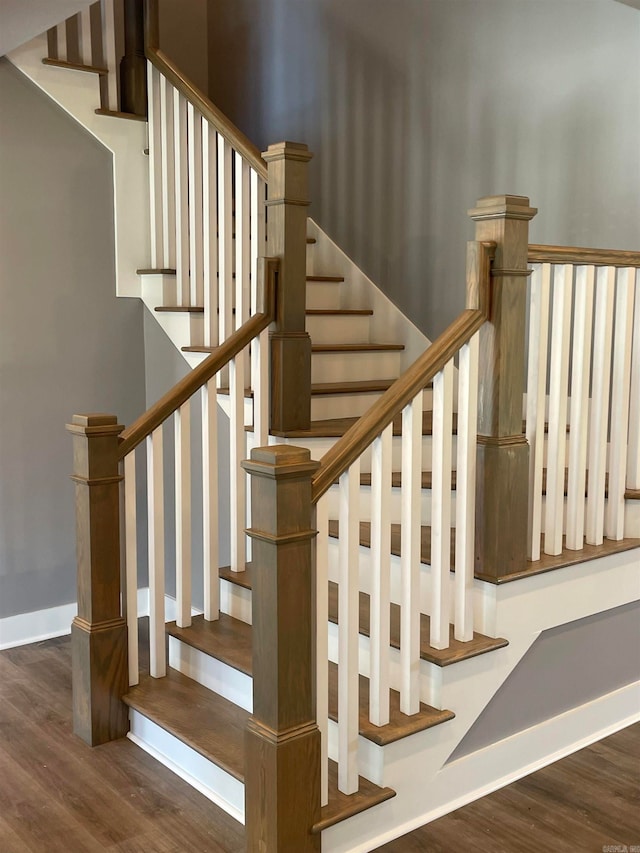 staircase featuring hardwood / wood-style floors