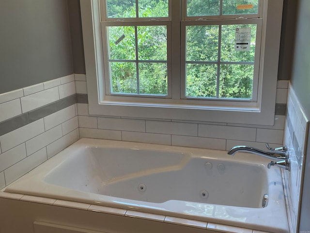 bathroom with tiled tub