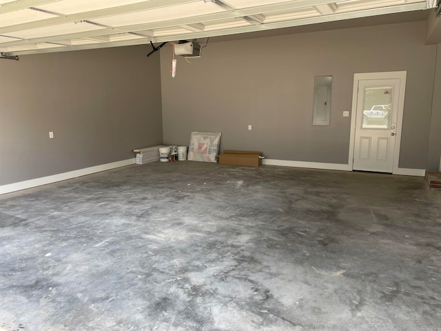 garage featuring a garage door opener and electric panel