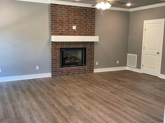 unfurnished living room with ceiling fan, a fireplace, crown molding, and dark hardwood / wood-style flooring