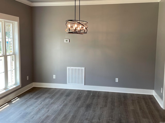 interior space with crown molding, dark hardwood / wood-style flooring, and plenty of natural light