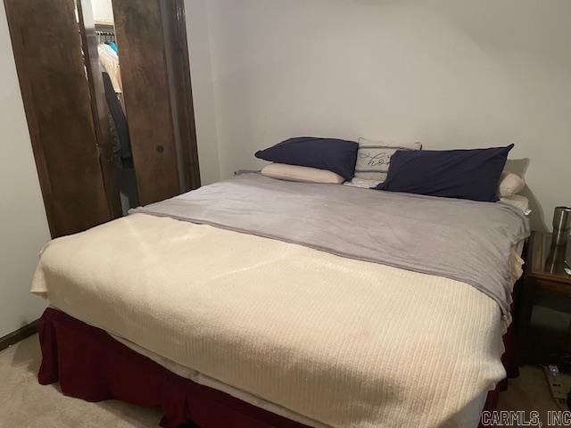 bedroom with light colored carpet