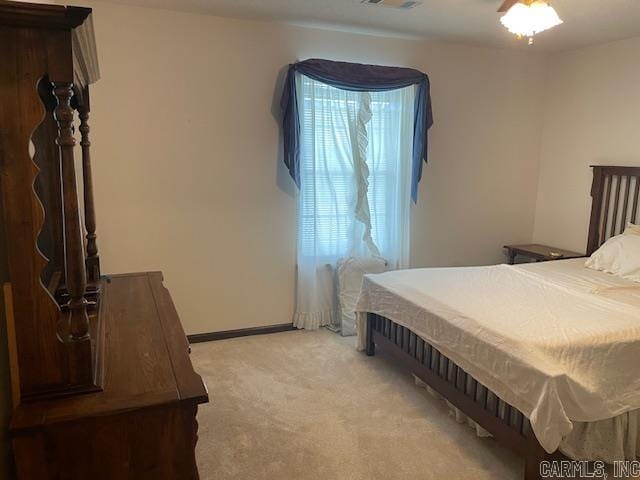 bedroom featuring light colored carpet