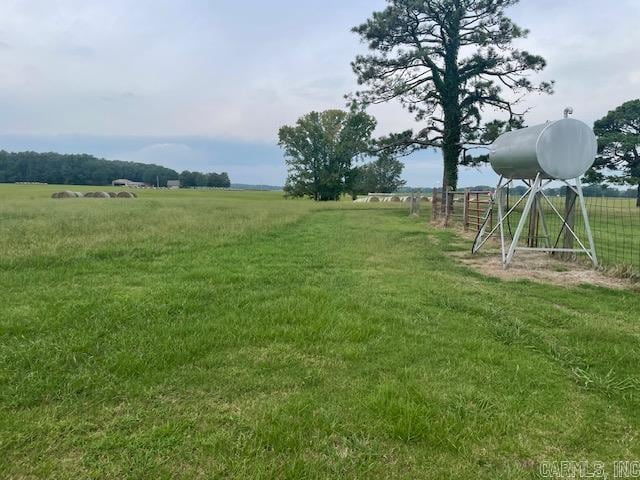 view of yard with a rural view