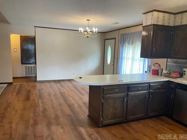 kitchen with kitchen peninsula, a textured ceiling, decorative light fixtures, dishwasher, and dark hardwood / wood-style flooring