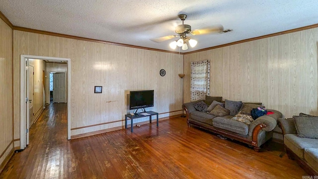 520 Main St, Newport, AR 72112 - living room featuring ornamental molding, ceiling fan, hardwood / wood-style floors, and a textured ceiling