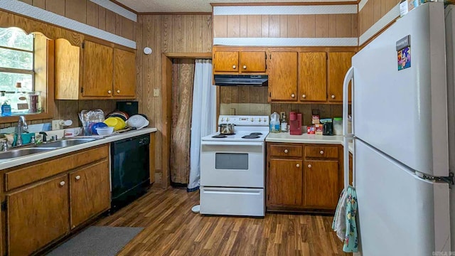 520 Main St, Newport, AR 72112 - kitchen featuring wooden walls, white appliances, dark hardwood / wood-style floors, and sink