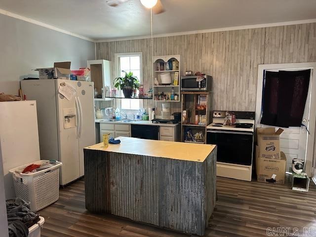 kitchen with ceiling fan, dark hardwood / wood-style flooring, white appliances, and a center island