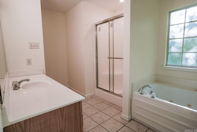 bathroom with tile patterned flooring, separate shower and tub, and vanity