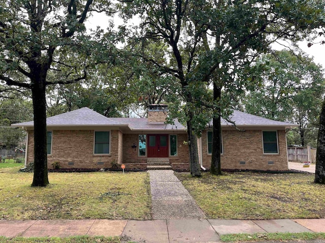 ranch-style home with a front lawn