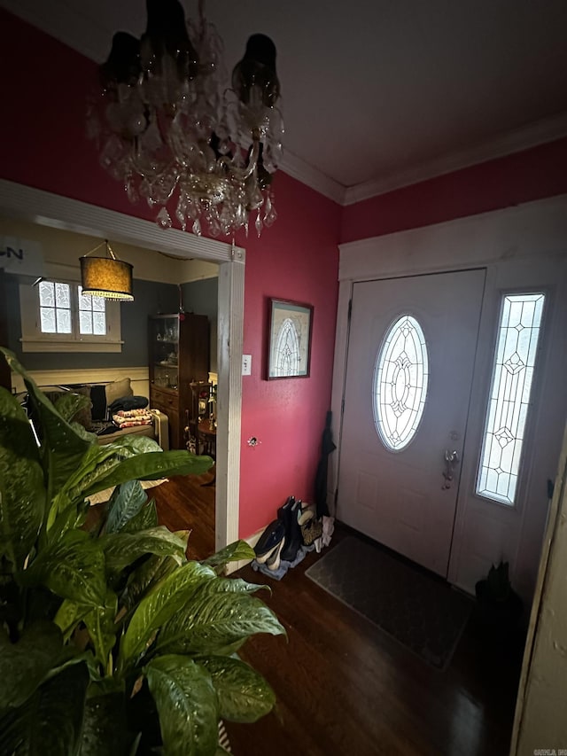 entryway featuring ornamental molding