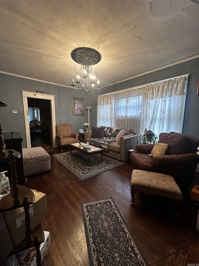 living room featuring a chandelier, dark wood-type flooring, crown molding, and a textured ceiling