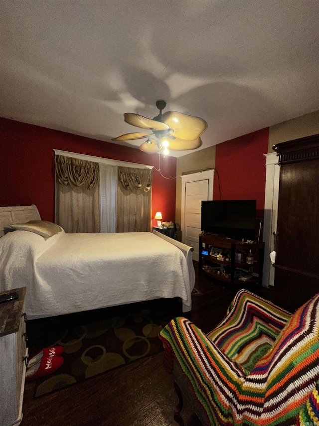 bedroom featuring a textured ceiling and a ceiling fan