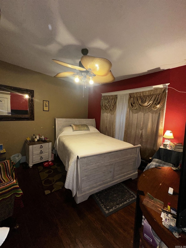 bedroom with dark wood-style floors and ceiling fan