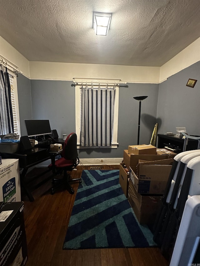 office with a textured ceiling and wood finished floors