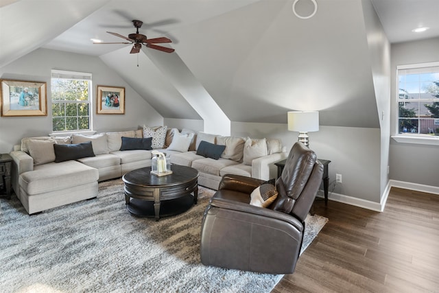 living room featuring lofted ceiling, dark wood-type flooring, and ceiling fan