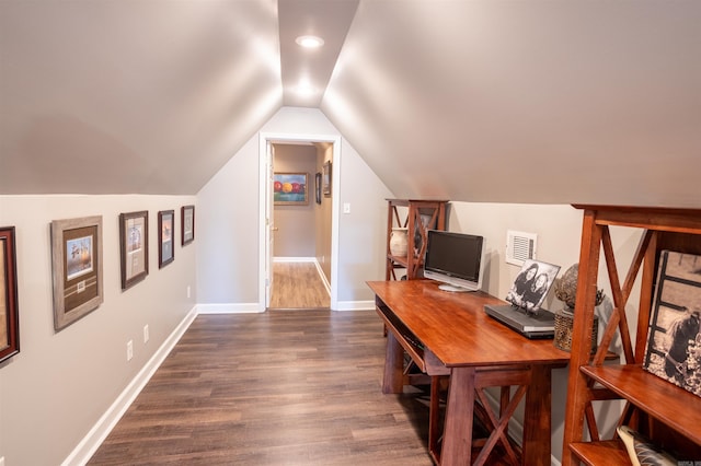 office area featuring vaulted ceiling and dark wood-type flooring