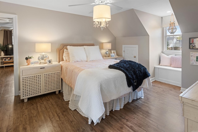 bedroom featuring ceiling fan, hardwood / wood-style flooring, and lofted ceiling