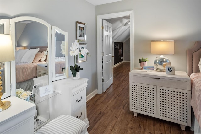 bedroom with dark hardwood / wood-style floors and vaulted ceiling