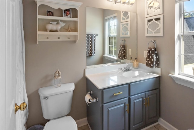 bathroom featuring vanity and toilet