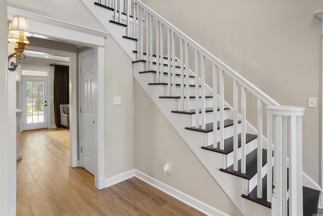 stairway with wood-type flooring