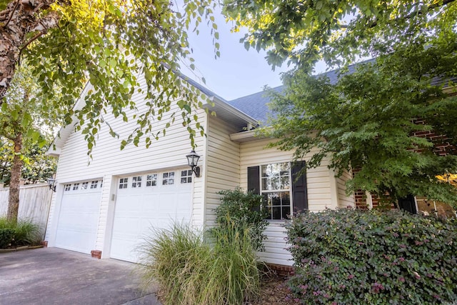 view of property exterior with a garage