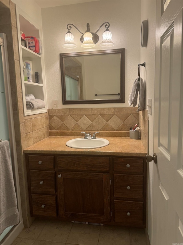 bathroom featuring vanity, backsplash, and tile patterned floors