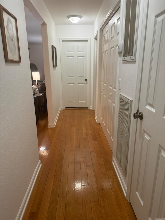 hallway with light wood-type flooring