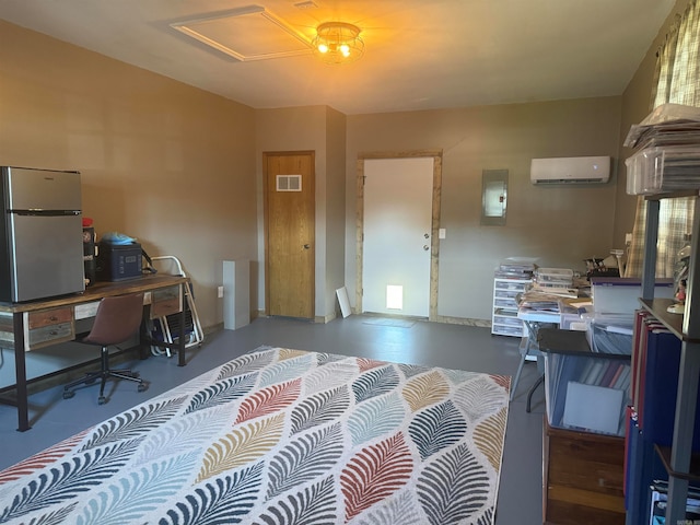 interior space with a wall mounted AC, concrete flooring, and stainless steel refrigerator