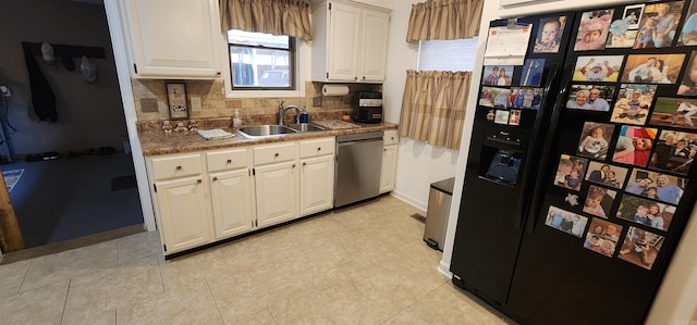 kitchen with sink, tasteful backsplash, stainless steel dishwasher, black fridge with ice dispenser, and white cabinetry