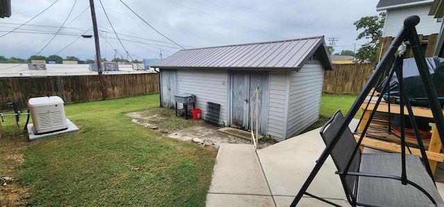 view of outbuilding featuring a yard