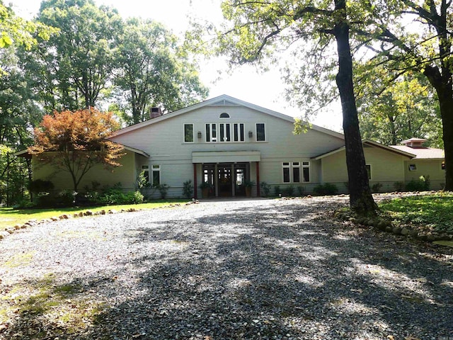 view of front of property featuring a carport