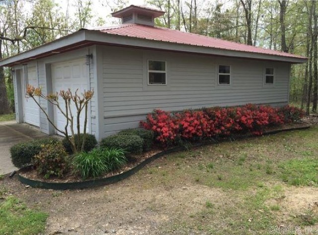 view of side of property featuring a garage