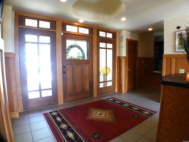 entryway with light tile patterned floors